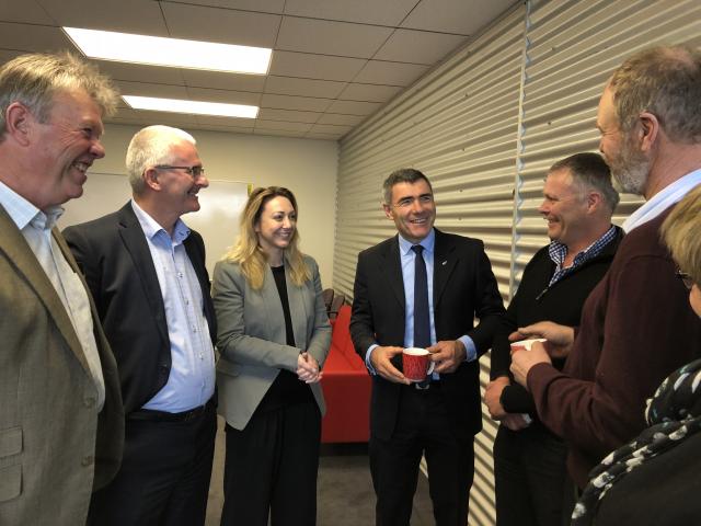 National's agriculture spokesman Nathan Guy (centre) and Invercargill MP Sarah Dowie, talk with agribusiness representatives in Invercargill last week. Photo: Supplied