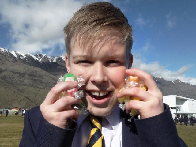 After the lolly scramble, pupil Jordan Courtney (13) shows off his haul of sweets.
