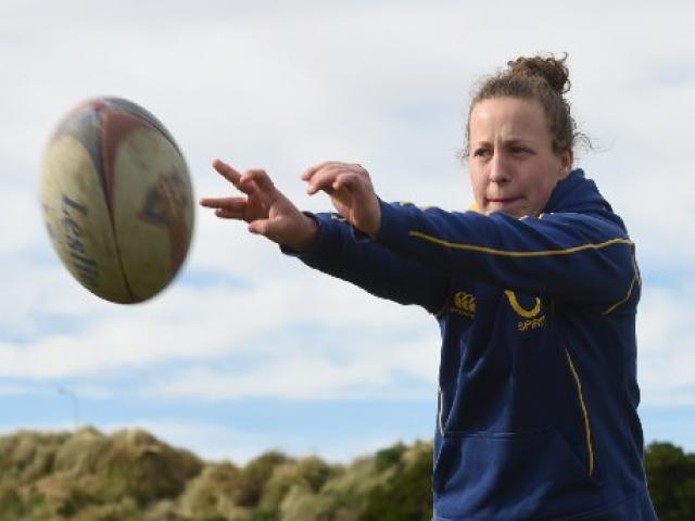 Looking ahead ... Otago Spirit openside flanker Georgia Mason (20)  helps out at a girls’ under...