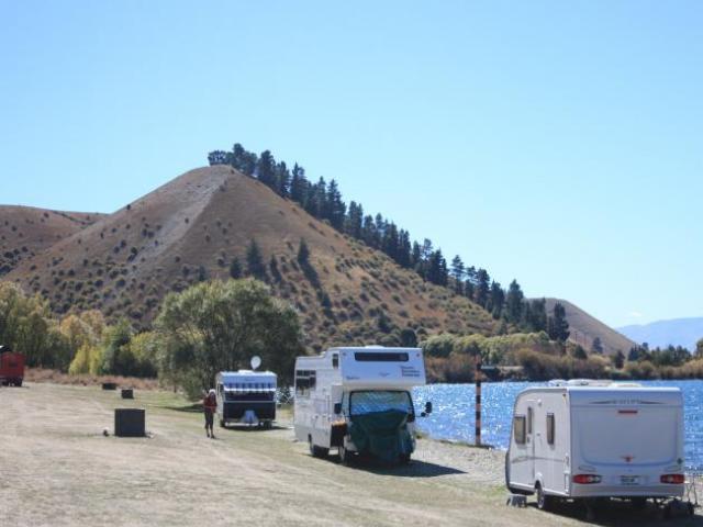 Camping vehicles parked on the shore of Lake Dunstan at Lowburn. Photo: ODT files