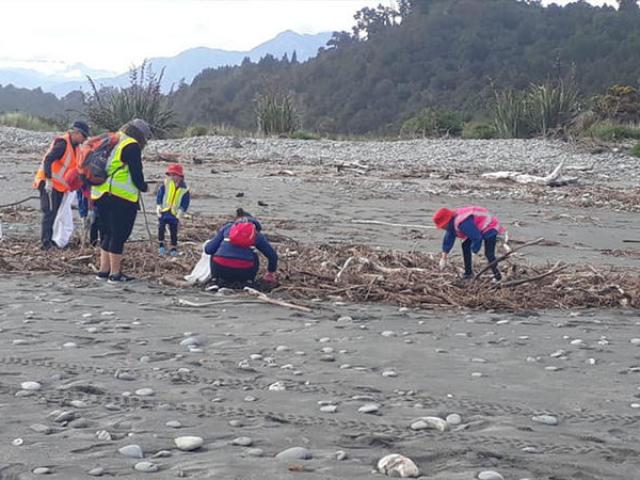 South Westland Coastal Cleanup volunteers helping clear litter and detritus in April. Photo:...