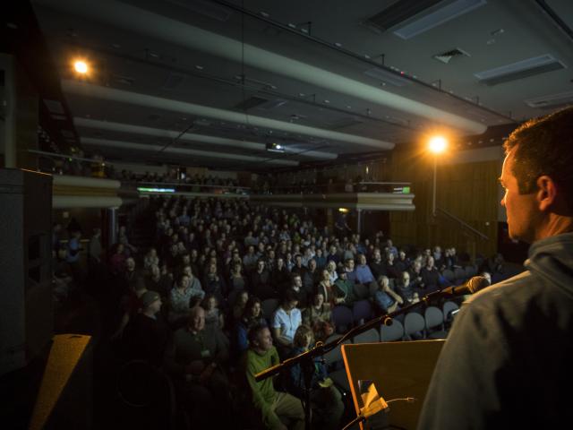New Zealand Mountain Film Festival director Mark Sedon addresses a packed house at the Lake...