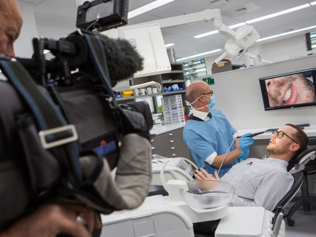 Trying it out … TV One reporter John McKenzie is filmed by cameraman Ross Wilson as Faculty of...