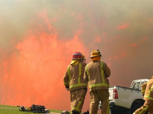 Firefighters prepare to attack the blaze in October 2015. Photo Stephen Jaquiery.