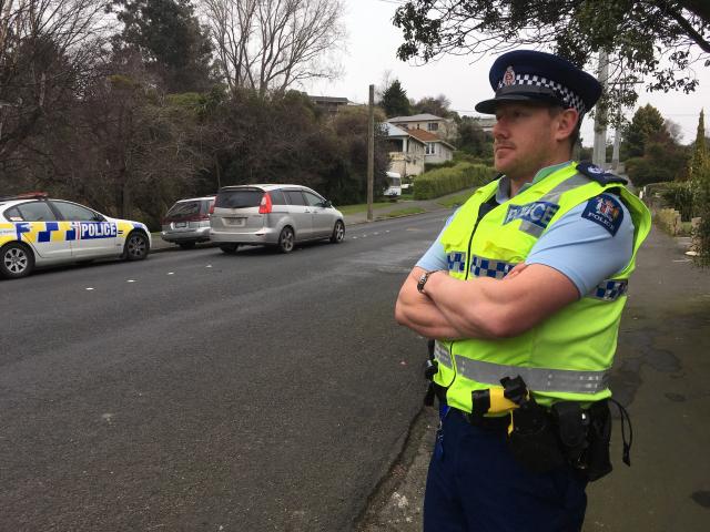 Senior Sergeant Jared Kirk watches motorists in Corstorphine Rd where a mobile speed-camera site...