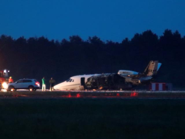A private Cessna 560XL aircraft is seen after crashing while landing at Aarhus Airport in...