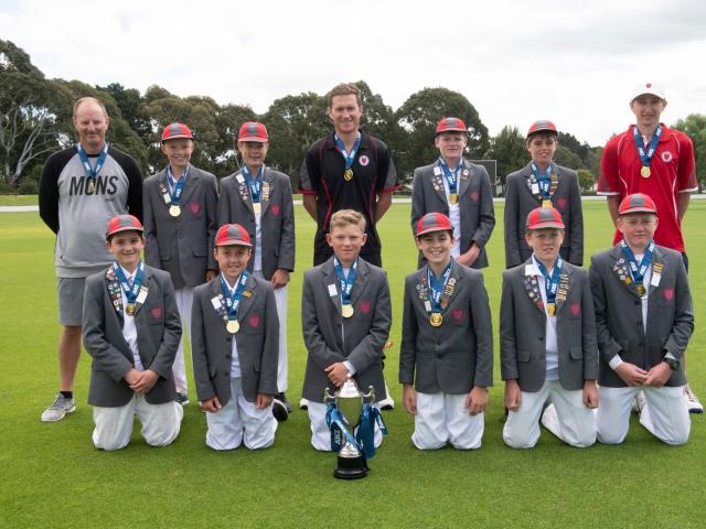 Medbury School's cricket team celebrate their national title at Lincoln. Photo: Ken Baker...