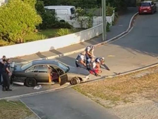 A man is held down by police in Christchurch after the incident. Photo: Video screengrab