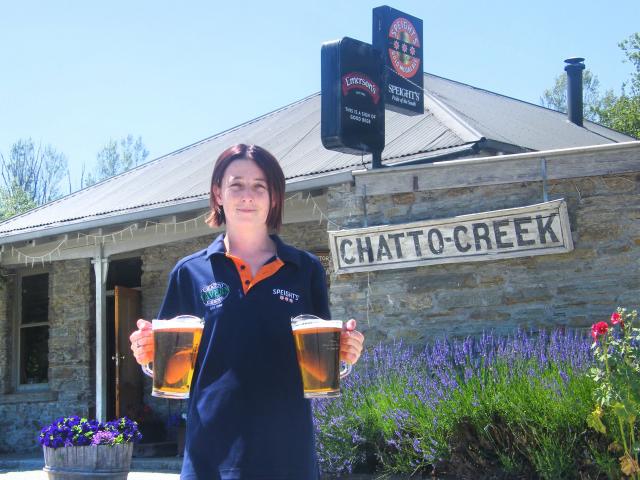 Chatto Creek Tavern staff member Ellen Naylor carries the essentials in front of the historic pub...