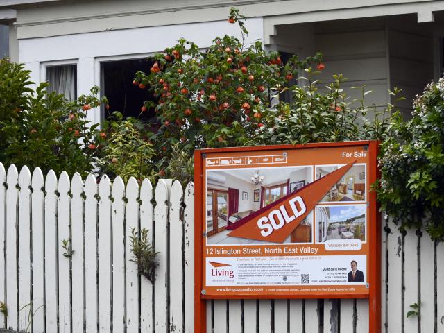  A sold sign hangs outside a house in Islington St, in Dunedin's Northeast Valley. PHOTO: GERARD...