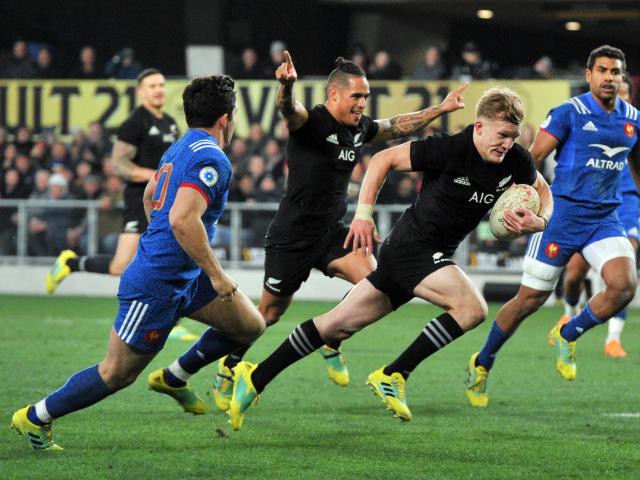 Arron Smith celebrates as Damian McKenzie scores a try against France in Dunedin in 2018. Photo:...
