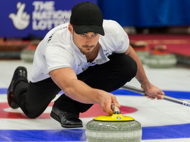 Anton Hood and Courtney Smith in action at the world curling mixed doubles championship in...