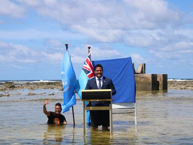 Tuvalu's Minister for Justice, Communication &amp; Foreign Affairs Simon Kofe gives a COP26...