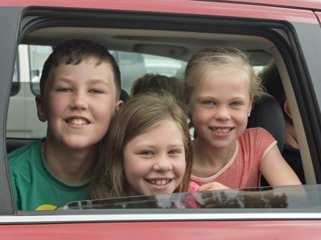 Oamaru children Cruz Illingworth and his sisters Indiana and Arnika were all smiles after...