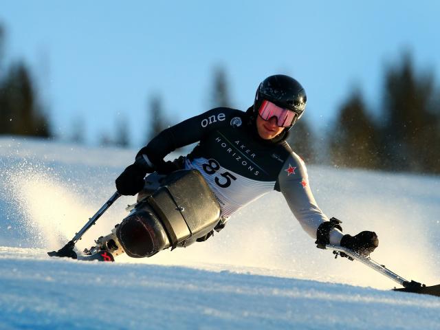 Aaron Ewen competes in the sitting downhill race at the world para snow sports championships in...