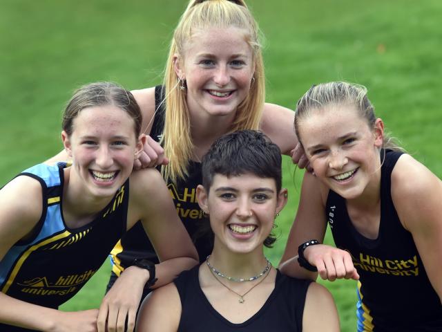 Hill City-University Blue runners (clockwise from front) Liberty McIntyre-Reet (20), Lila Rhodes ...