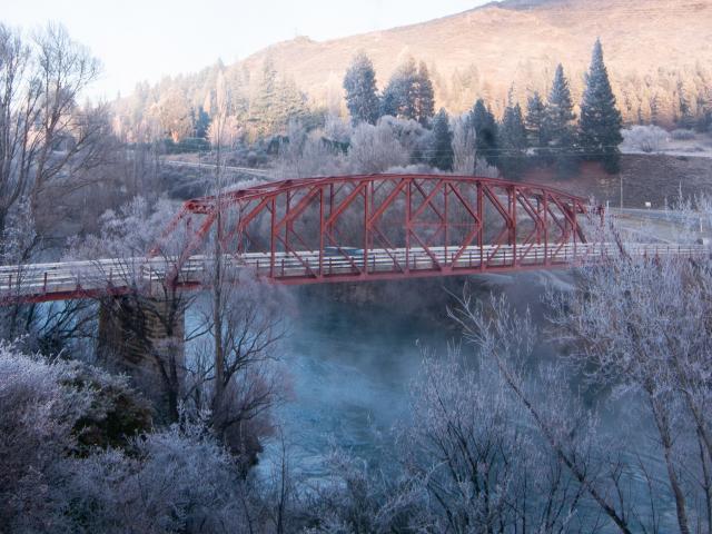 A car passes over Clyde’s red bridge in Central Otago in hoar frost conditions yesterday morning....