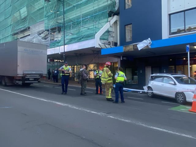 Emergency services at the scene with the truck following the accident. Photo: Craig Baxter