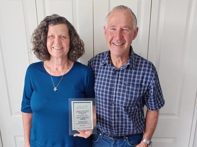 Southland oat growers Graeme and Elspeth Gardyne display a plaque from Plant Research Ltd...