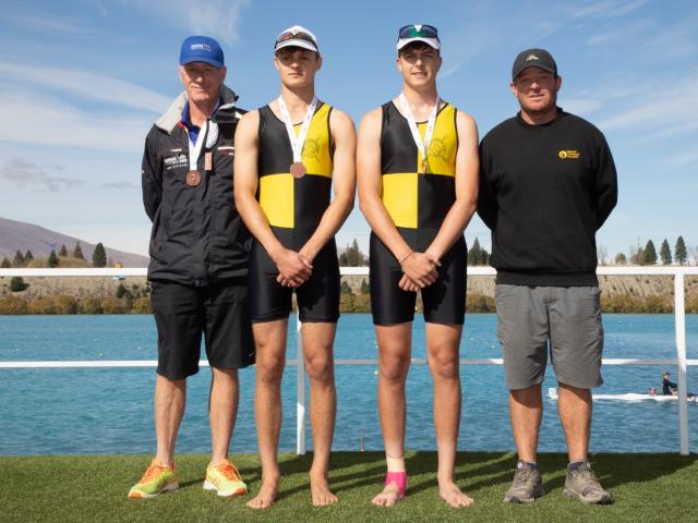 Standing on the podium following their bronze medal in the boys under-18 novice double sculls are...
