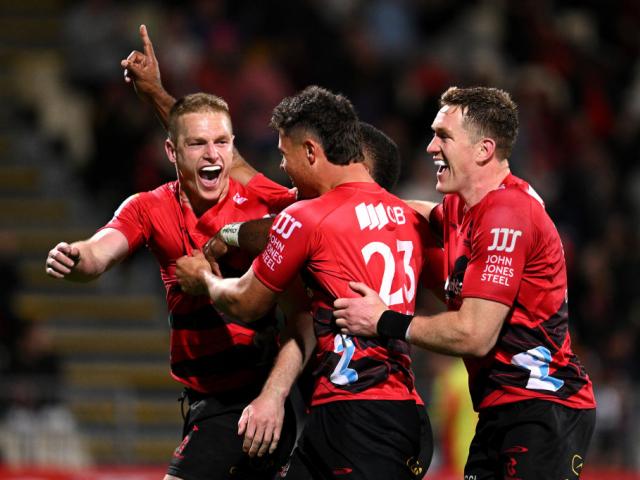 The Crusaders' Johnny McNicholl celebrates scoring a try against the Chiefs. Photo: Getty