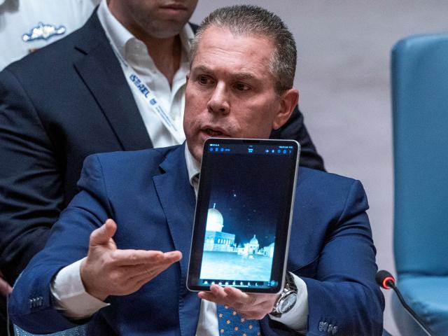 Israel's Ambassador to the United Nations, Gilad Erdan, shows a video of Iranian missile attacks...