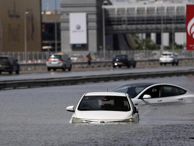 Cars sit stranded in floodwaters caused by heavy rains in Dubai. Photo: Reuters