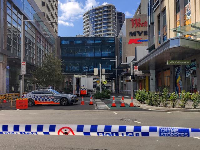 A police car is parked outside Westfield Bondi Junction Mall following Saturday’s stabbings in...