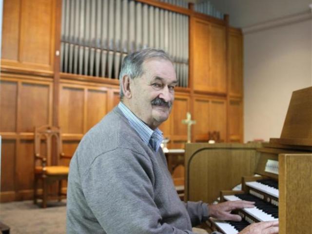 Baring Square Methodist Church parish steward Alister Smyth with the church’s new organ. Photo:...