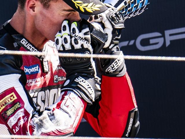 Southland motorcycle rider Cormac Buchanan hugs his trophy after finishing third in race two at...