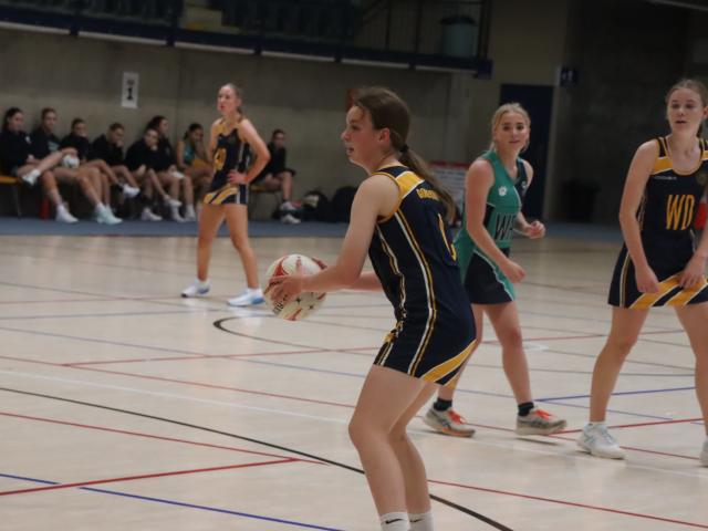 Passing . . . Māruawai College College senior A centre Layla Connorton,16, looks to feed the ball...