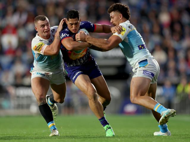 Addin Fonua-Blake of the Warriors is tackled during the Anzac Day clash against the Titans in...