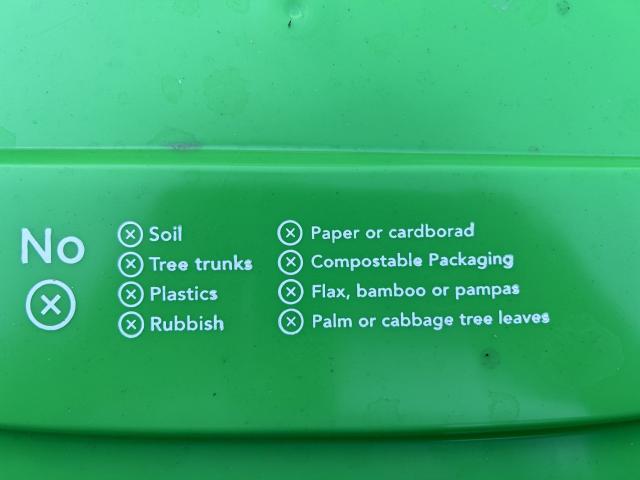 One of the Dunedin City Council's new green wheelie bins which has the word cardboard spelt...