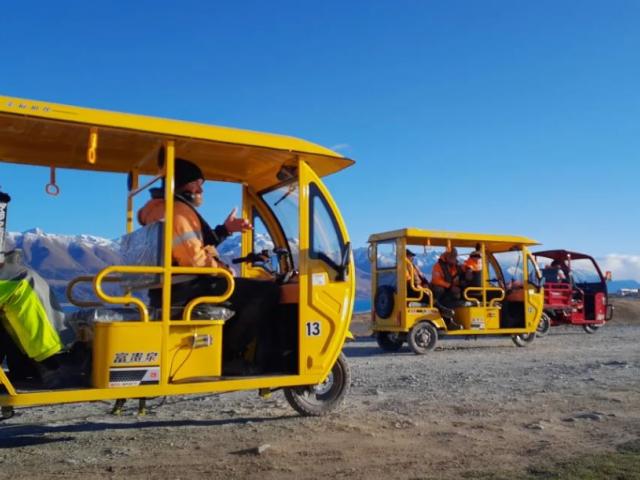The people moving tuk-tuks in action at a Mt Cook Alpine Salmon farm. Photo: Rick Ramsay / Mt...