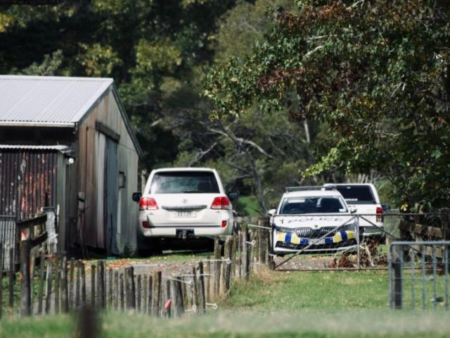 Police at the scene on Anzac Valley Rd in rural Waitākere. Photo: RNZ