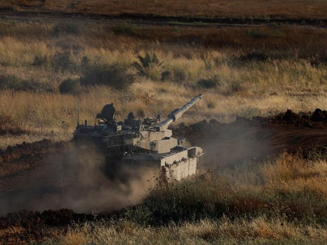 An Israeli tank manoeuvres near the Israel-Gaza border earlier this week. Photo: Reuters