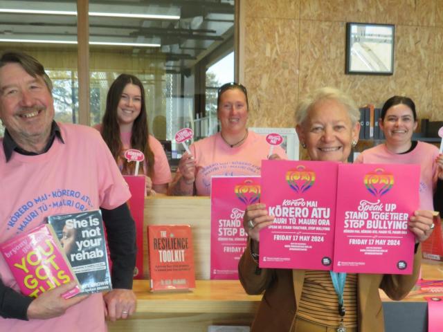 Safer Mid Canterbury members with their Pink Shirt Day display (from left) Selwyn Price, Tayla...
