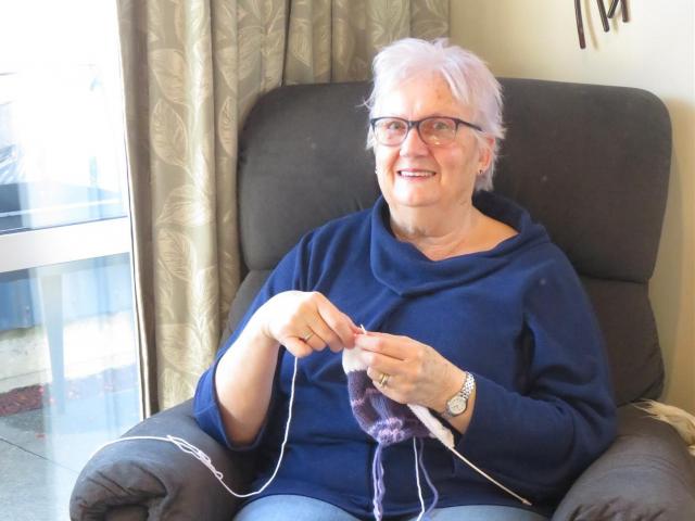 Judy Swaney knitting Humpty Dumpty toys at home for charity. Photo: Supplied