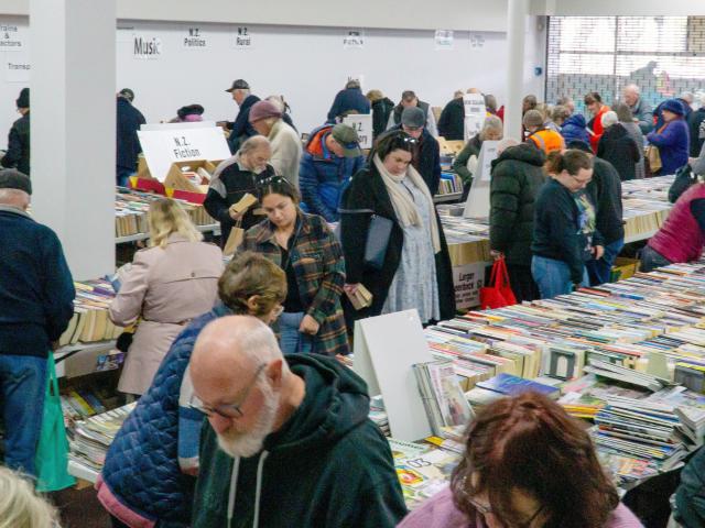 Customers rush into Oamaru's Bookarama yesterday in the former Noel Lemming building to grab the...