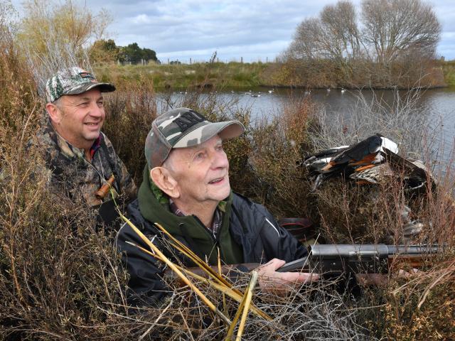 Searching the sky on the opening day of duck-shooting season, on Bungards farm south of Mataura...