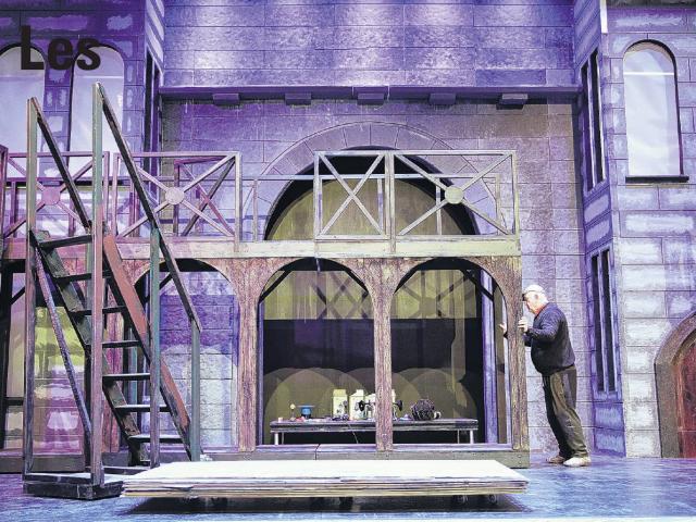 Set co-ordinator David Bleach is among volunteers getting the Les Miserables set ready. Photo:...