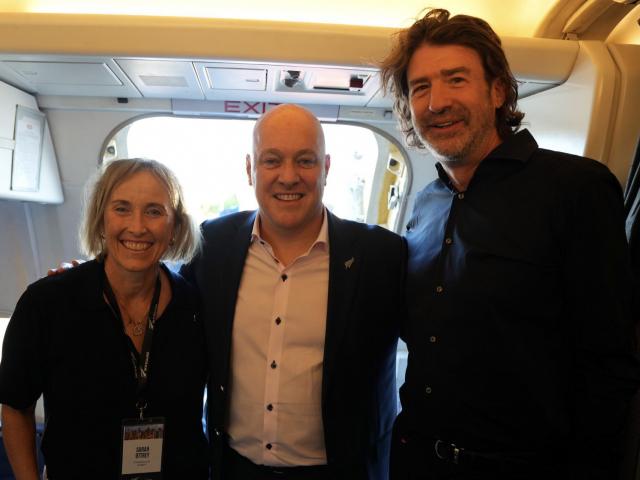 Sarah Ottrey boards the RNZAF Boeing 757 with Prime Minister Christopher Luxon and Oritain chief...