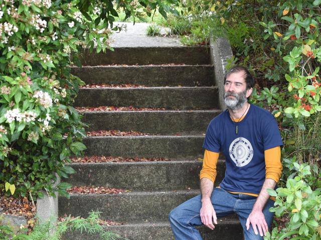 Wakari resident Jeremy Quinn sits on his and his neighbour’s shared staircase that waste from the...