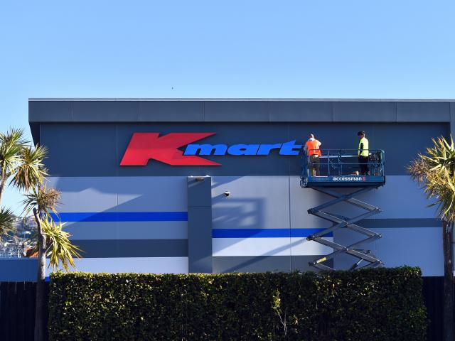 Workers put up a Kmart sign at the new site in South Dunedin. PHOTO: GREGOR RICHARDSON