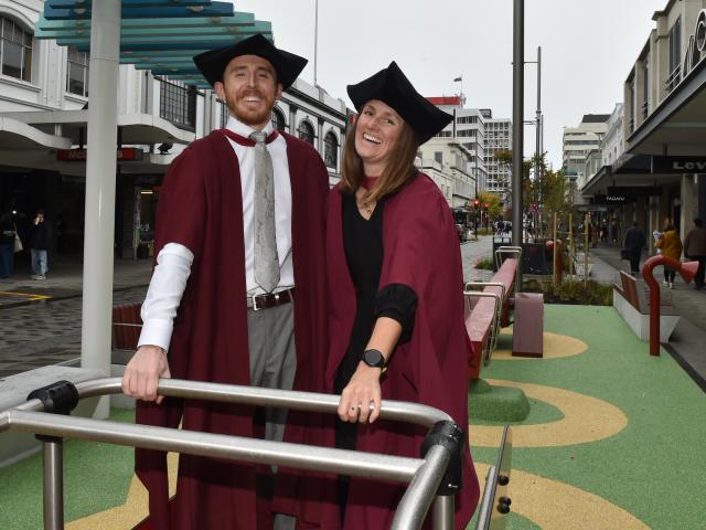 University of Otago PhD graduates Finn Ryder and Louise Bennett-Jones on the standing see-saw in...