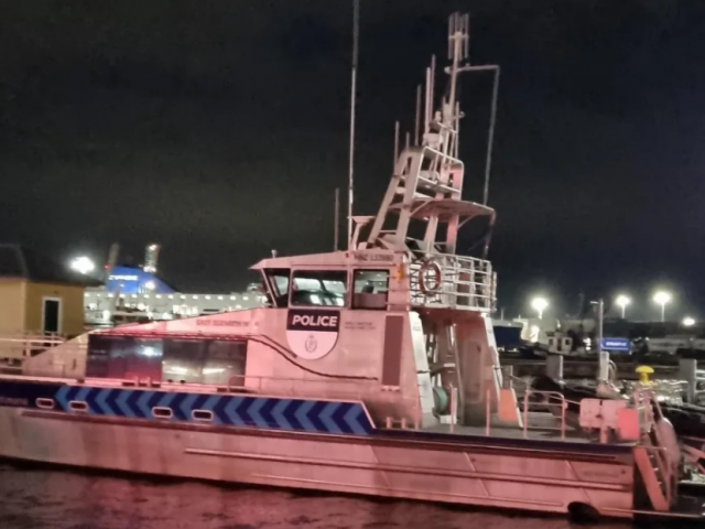 The Wellington police boat moored at Wellington Harbour after spending the day searching for a...