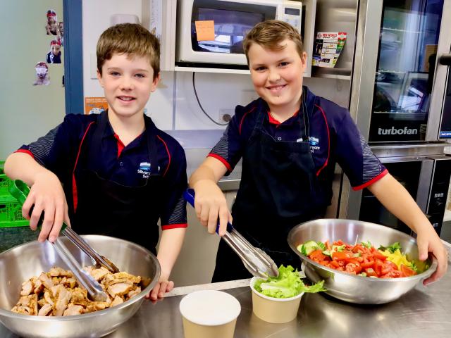 Jack Adam and Harry Tapp, both aged 10, help prepare lunches at Silverstream School. PHOTO: SIMON...