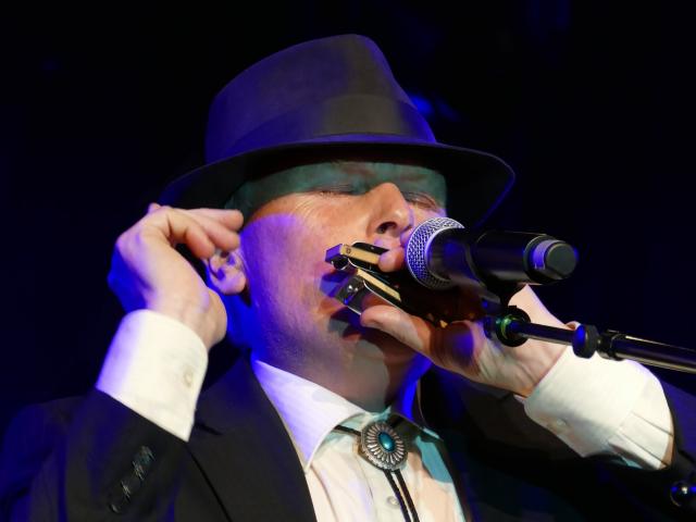 Gore instrumentalist Brendon Fairbairn gees up the crowd with his harmonica during the MLT Gold...