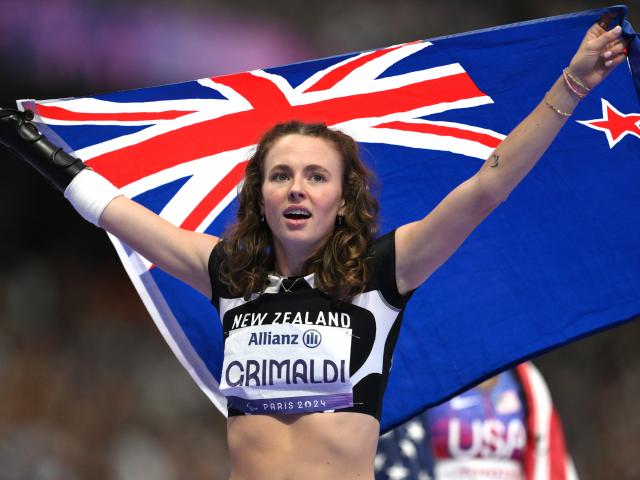 Dunedin athlete Anna Grimaldi celebrates winning gold in the women's 200m T47 final. PHOTOS:...