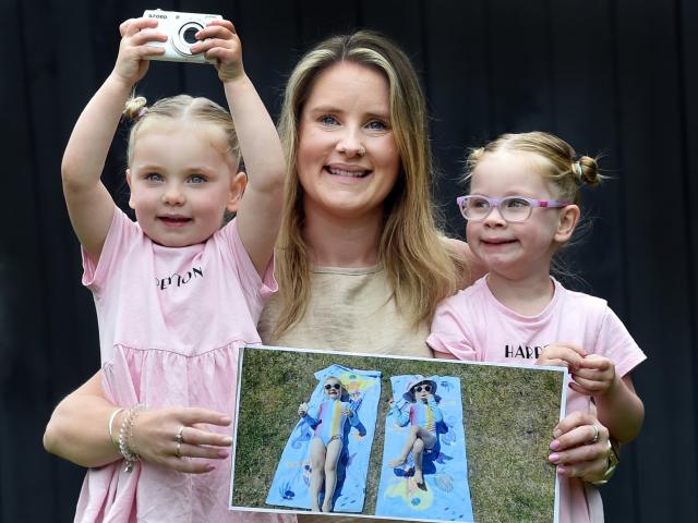 Michaela Lobb shows off her winning Otago Daily Times "Magic Moments" photograph, alongside the...